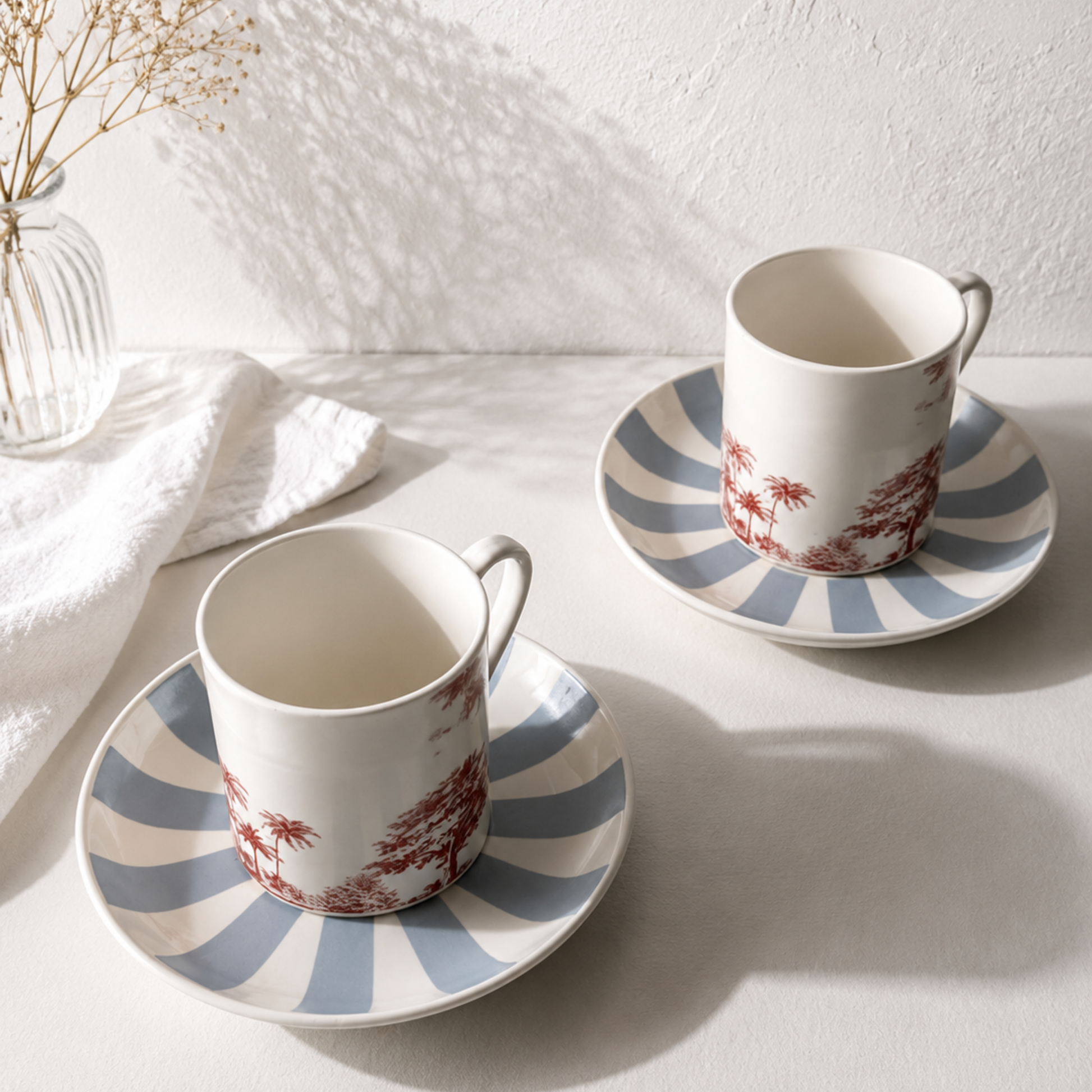 Portside Cup and Saucer set of 2 — bone china cups on powder-blue striped saucers with burgundy toile illustration