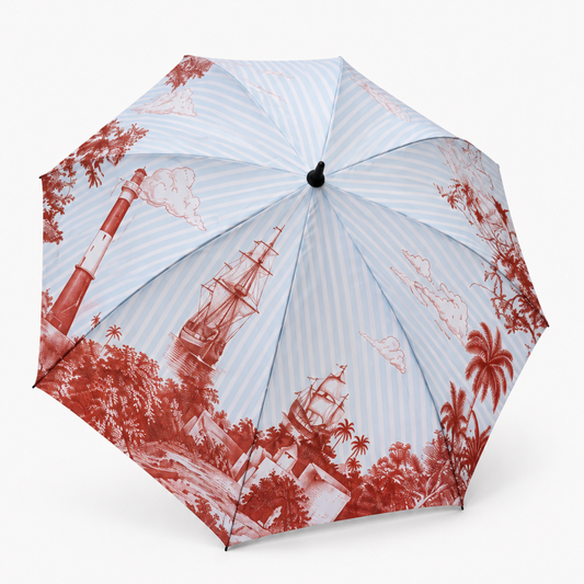 The Bombay Ballad umbrella — powder-blue striped 60 inch golf canopy with burgundy toile illustration of lighthouses, ships and palms